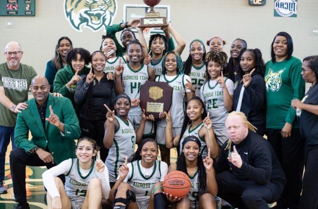 the 2023-2024 lady bobcats celebrate with their coaches after their gcaa championship win